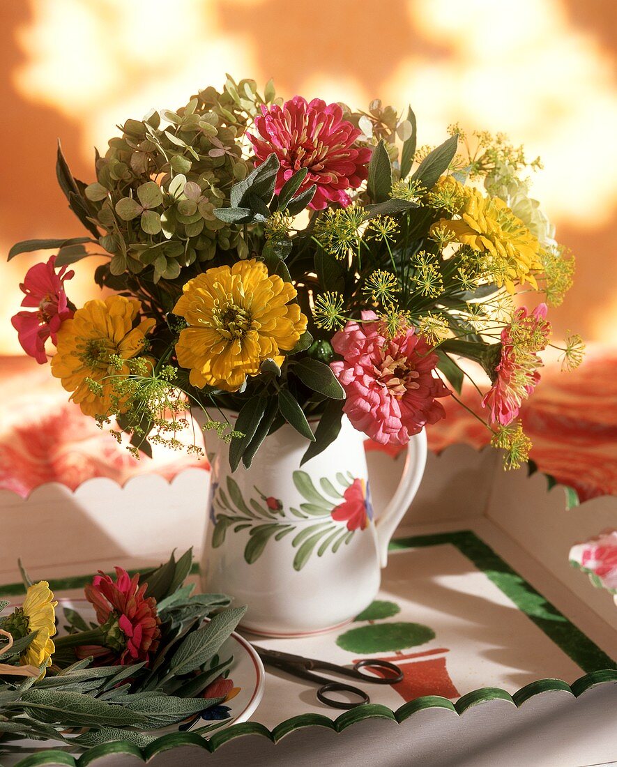 Bouquet of herbs and flowers in a vase