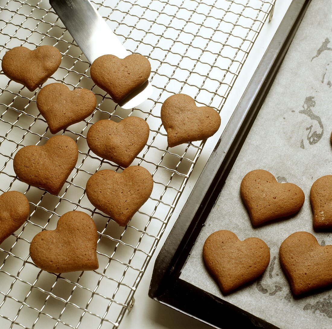 Cooling gingerbread hearts on cake rack