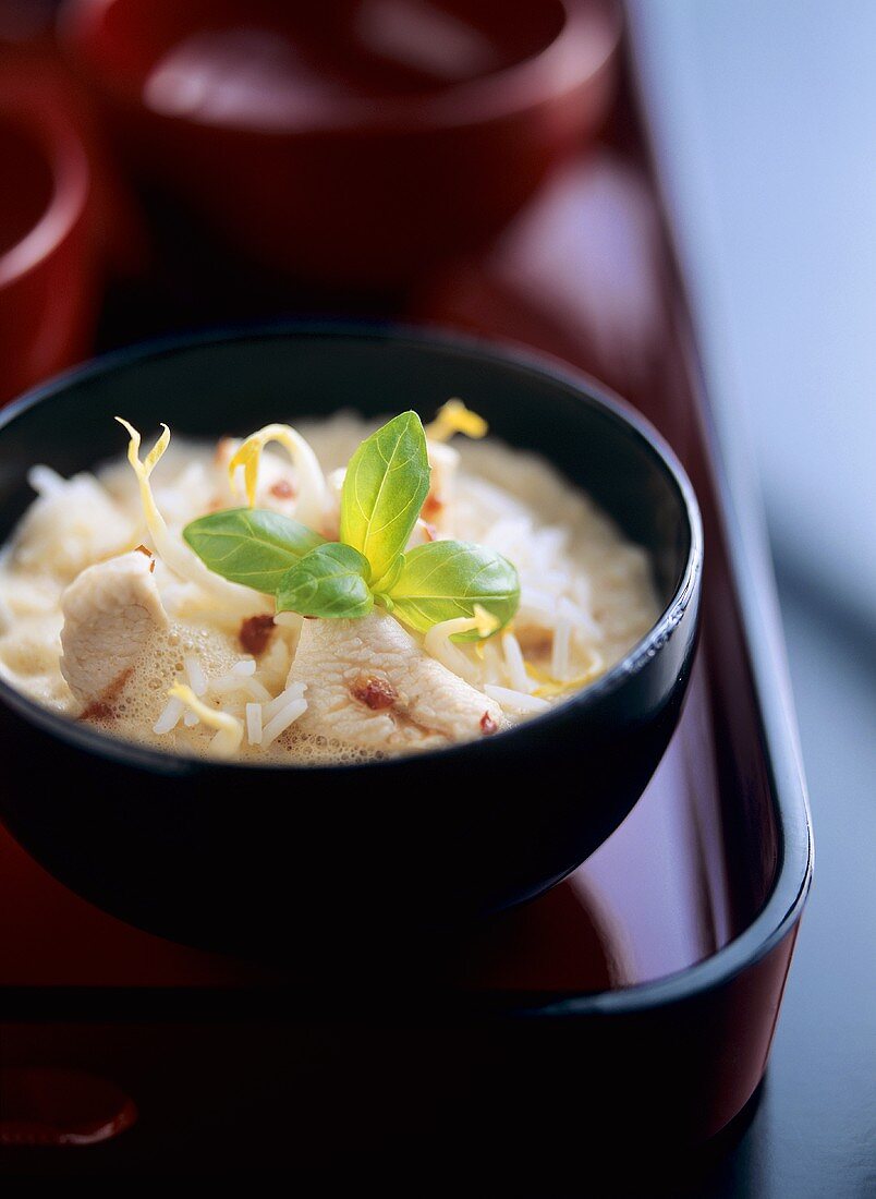 Coconut soup with chicken breast fillet, soya sprouts & basil