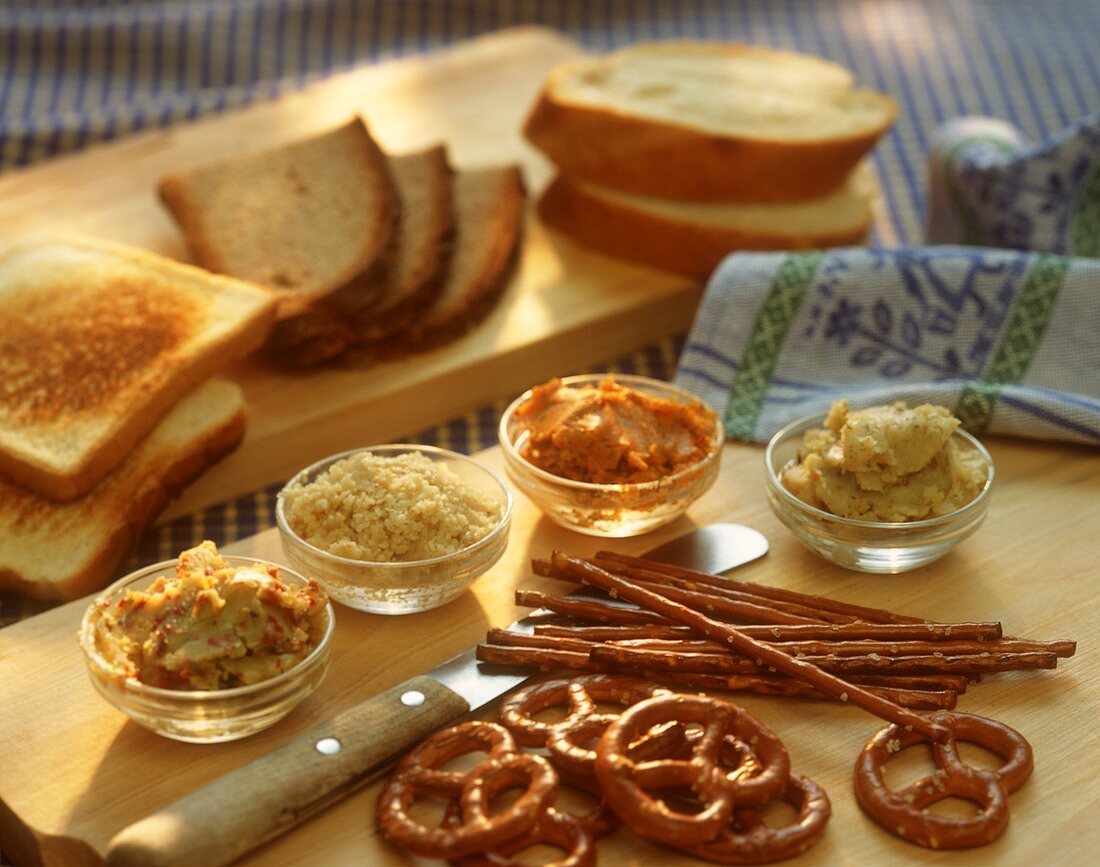 Salted biscuits, spreads and slices of bread for buffet