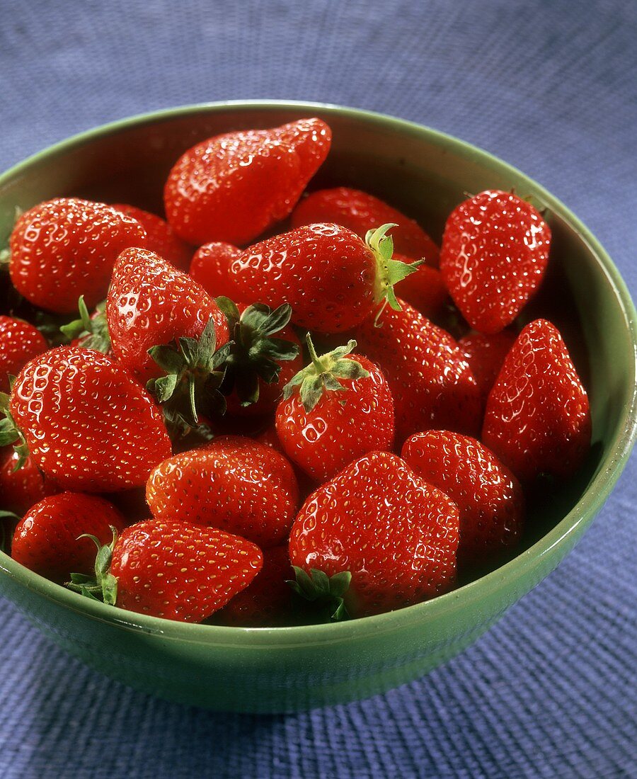 Many Freshly Picked Strawberries; Strawberry Blossom