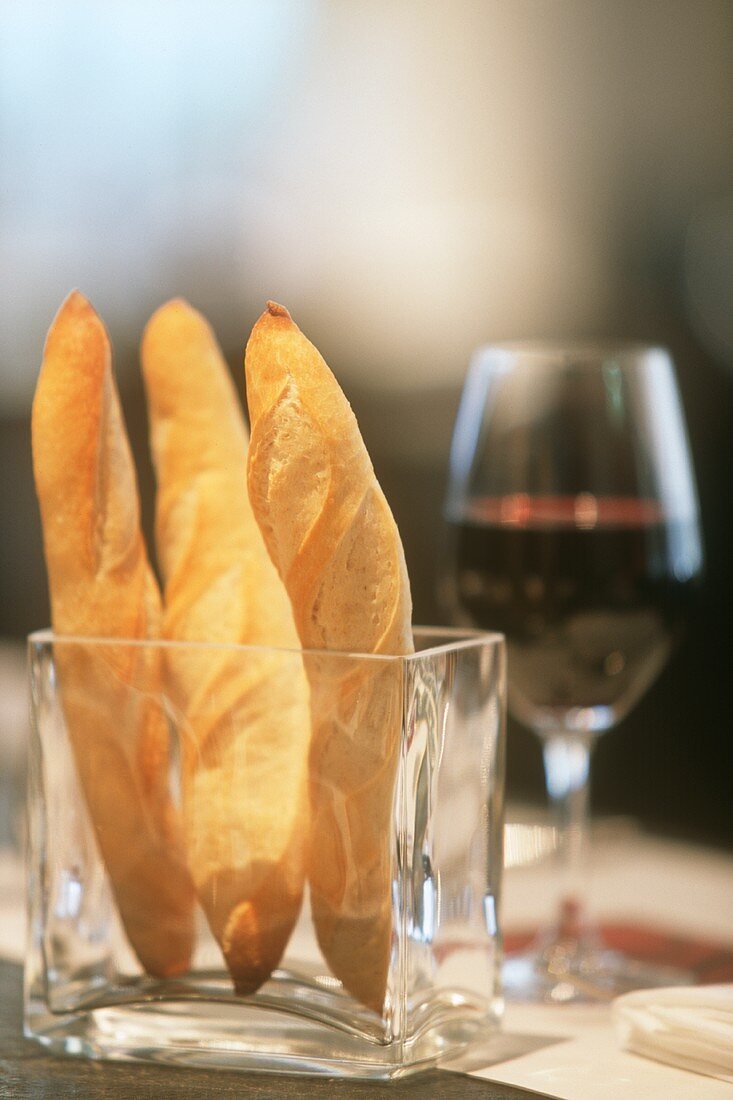 Bread sticks and a glass of red wine