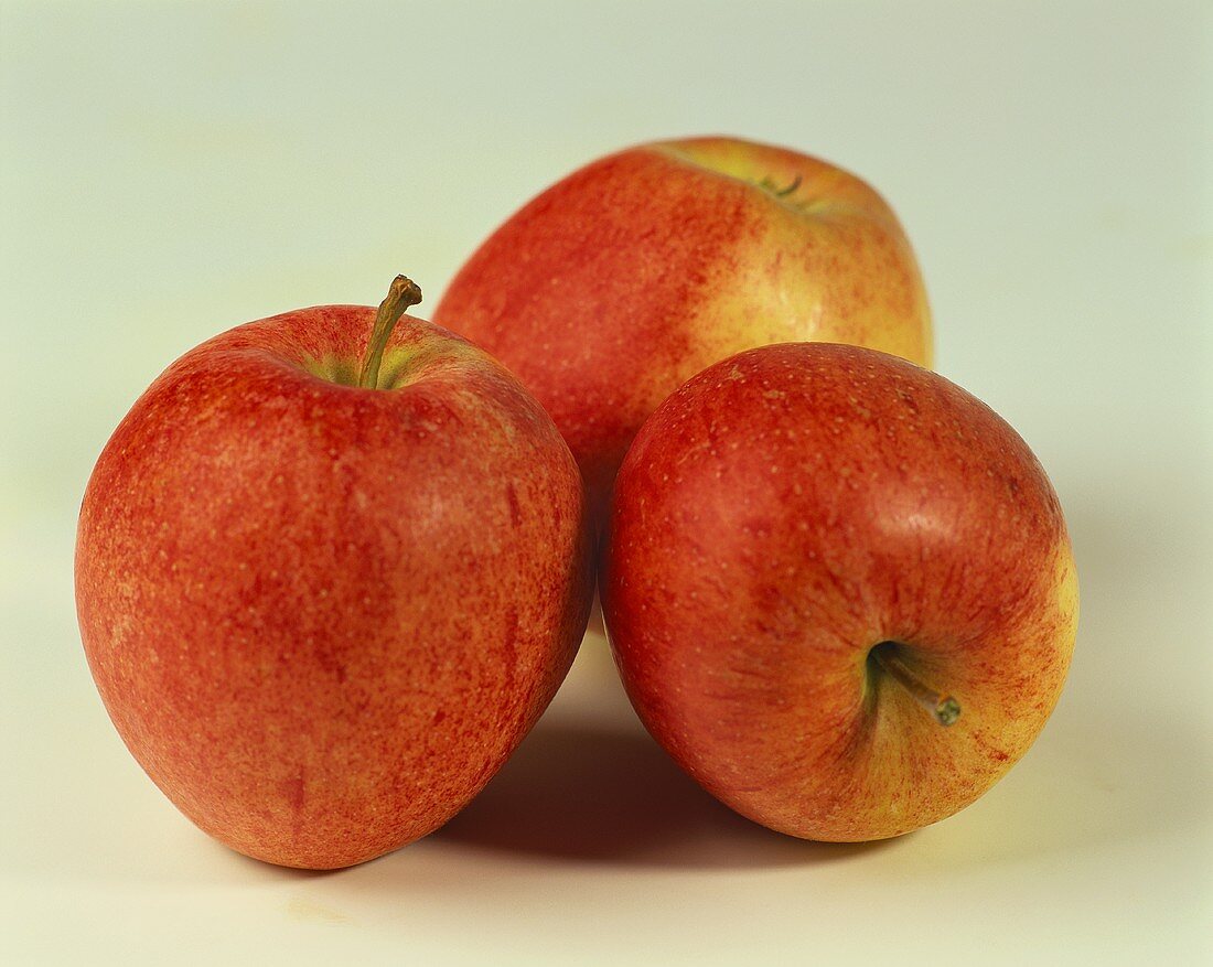 Three Gala apples