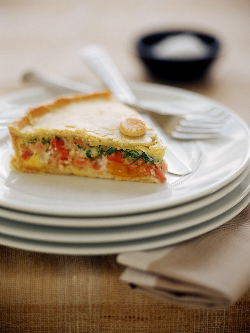 Spicy vegetable pie with bacon, eggs and herbs