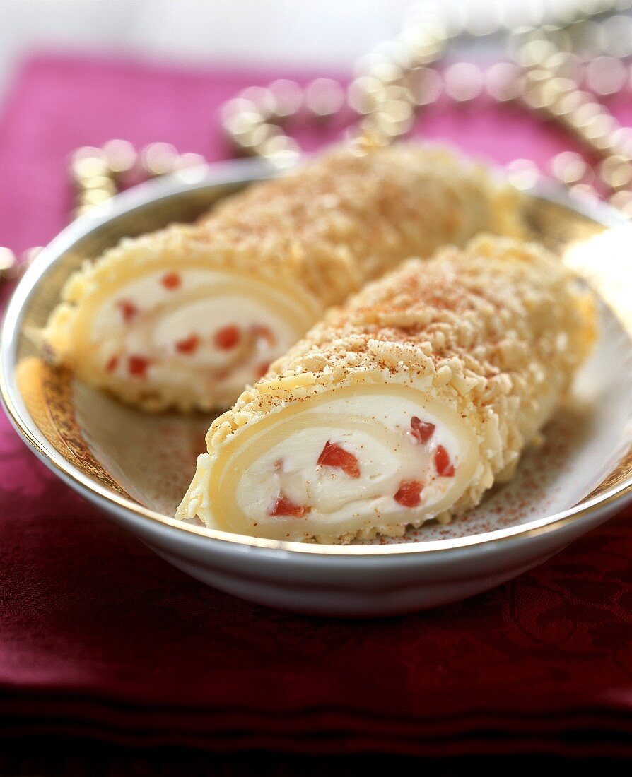 Soft cheese roulade with peppers and almonds