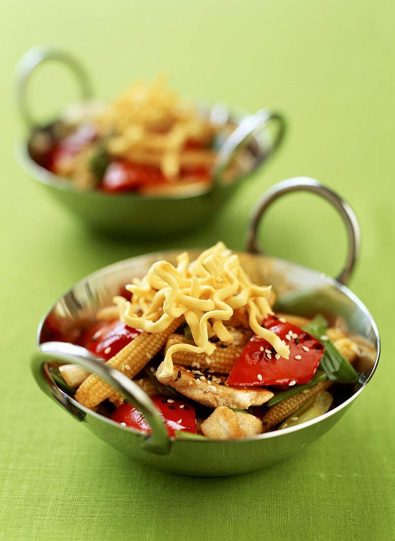 Fried vegetables with turkey and noodles in wok