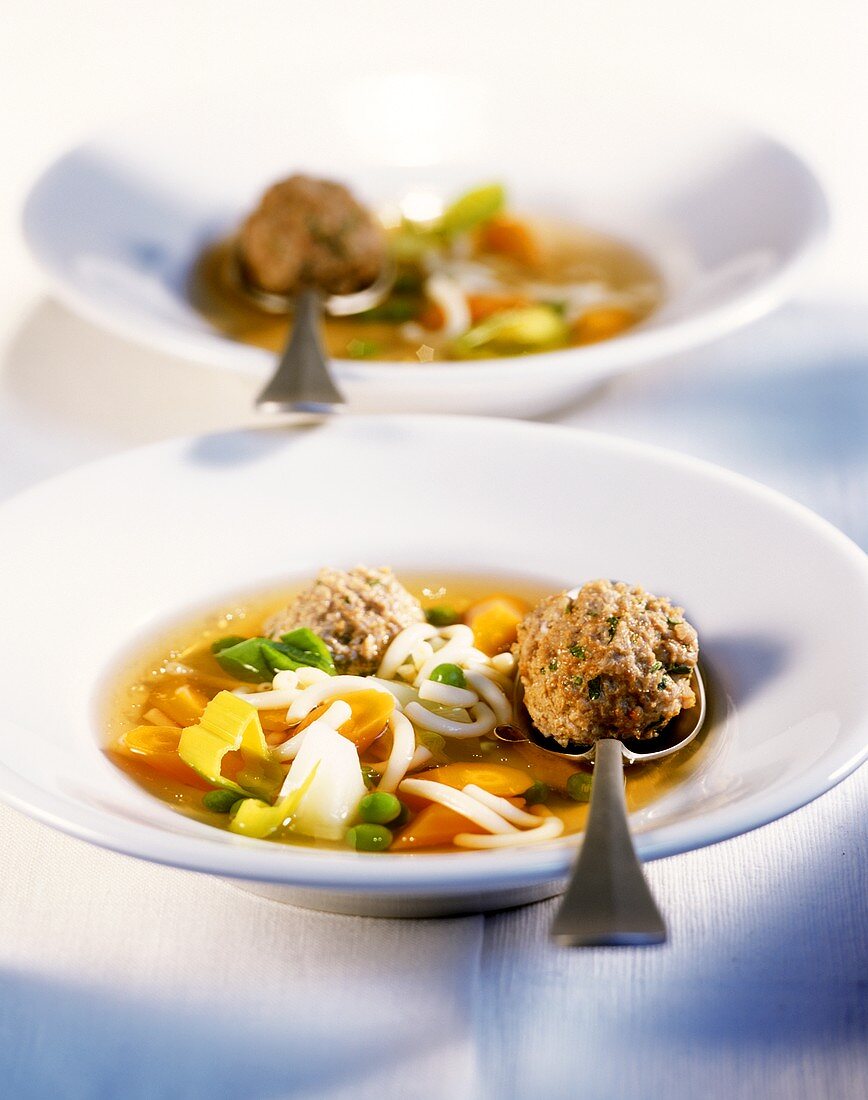 Vegetable soup with noodles and meatballs
