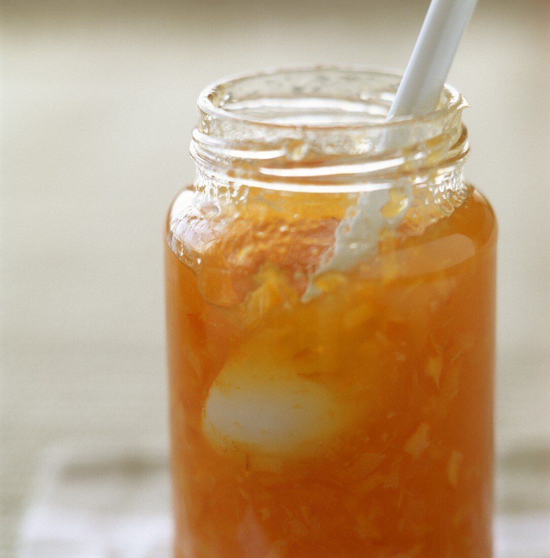 China spoon in a jar of Seville orange marmalade