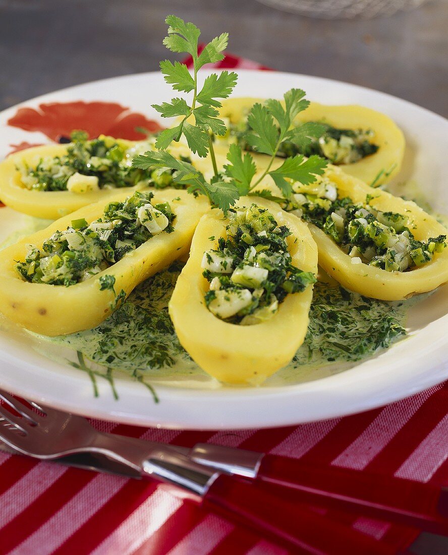 Steamed, stuffed herb potatoes in herb sauce