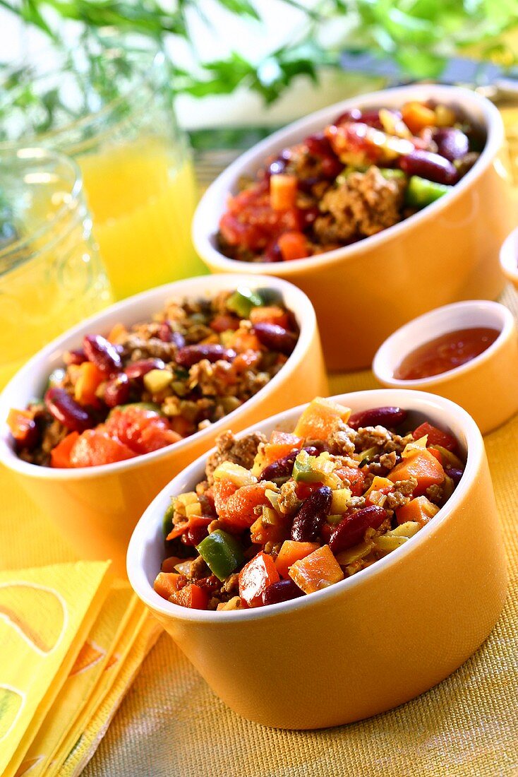 Chili con carne in orange bowls