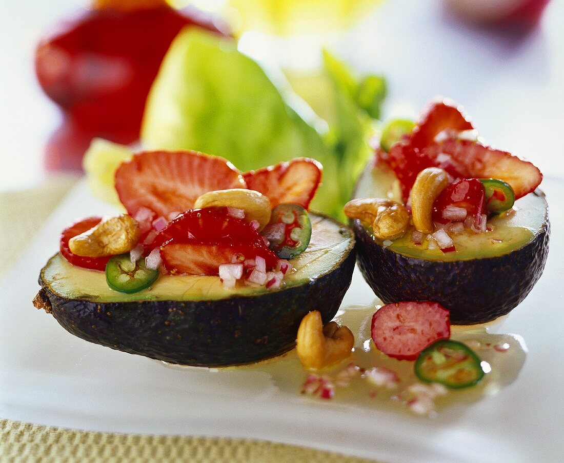 Stuffed avocado with strawberry and chili salad