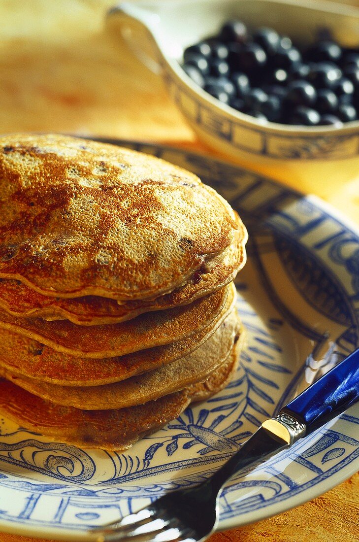 A pile of blueberry pancakes