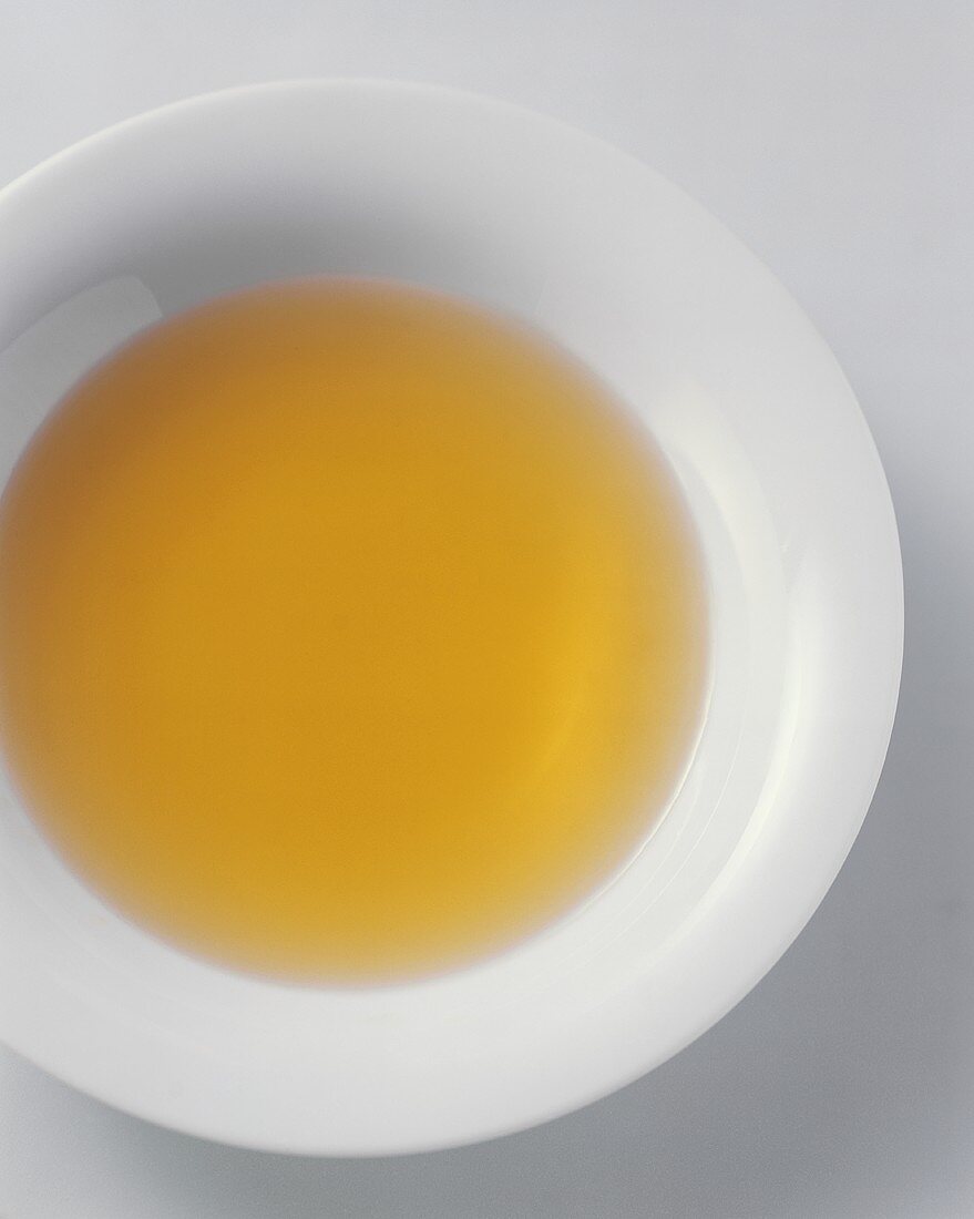 Clear broth in plate