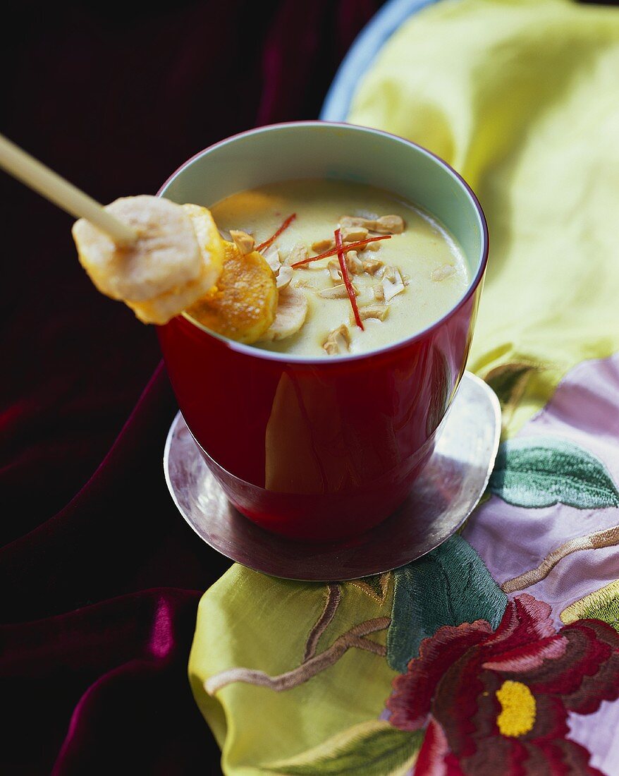 Exotic stew with bananas in soup bowl