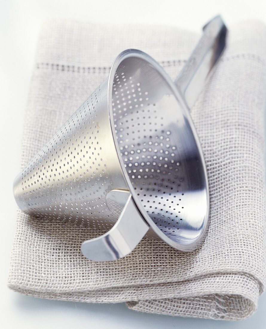 Conical sieve on kitchen cloth