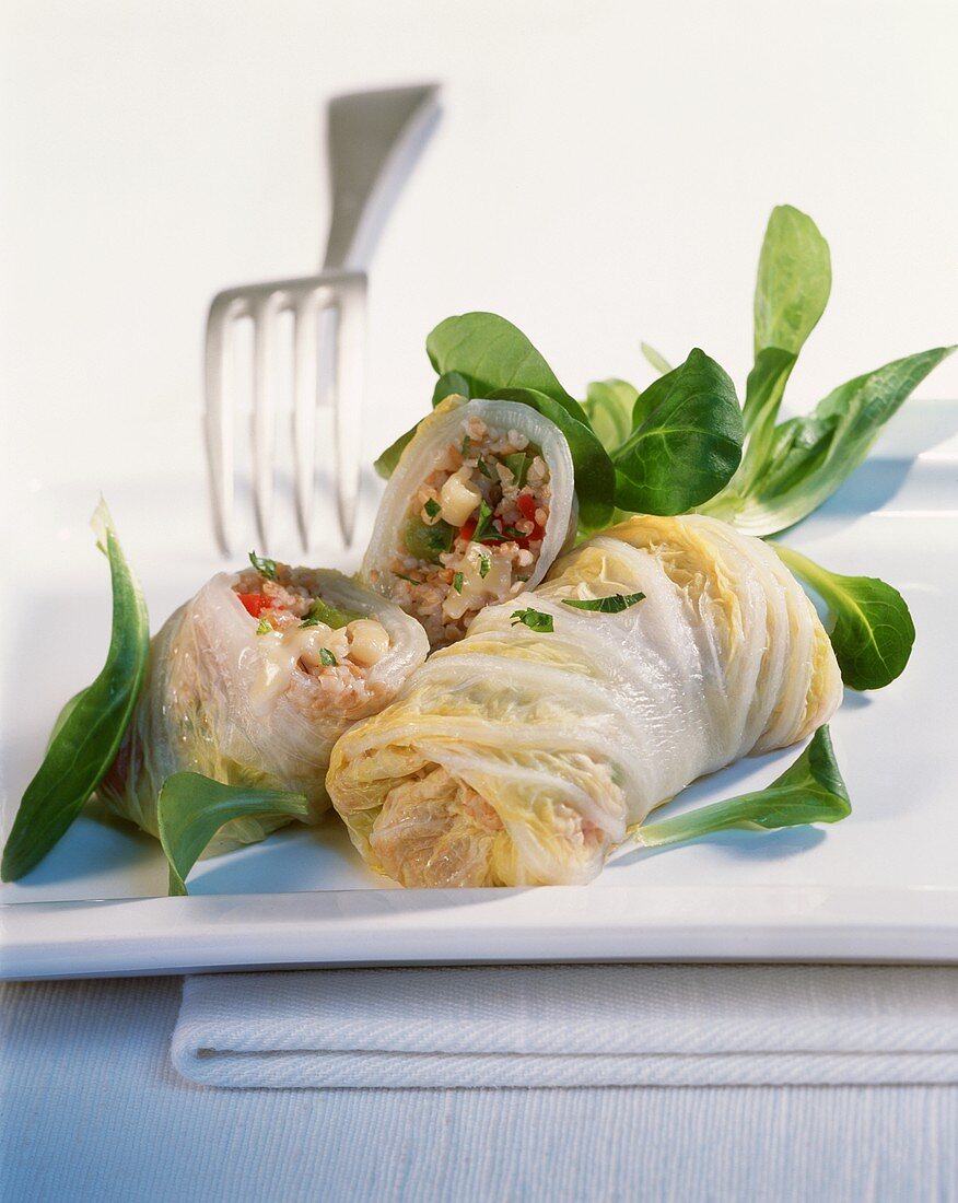 Chinese cabbage rolls with spelt and vegetable filling
