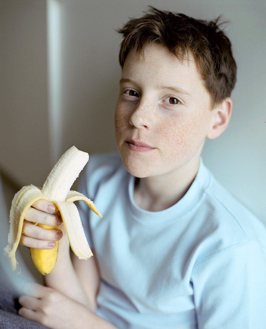 Boy eating a banana