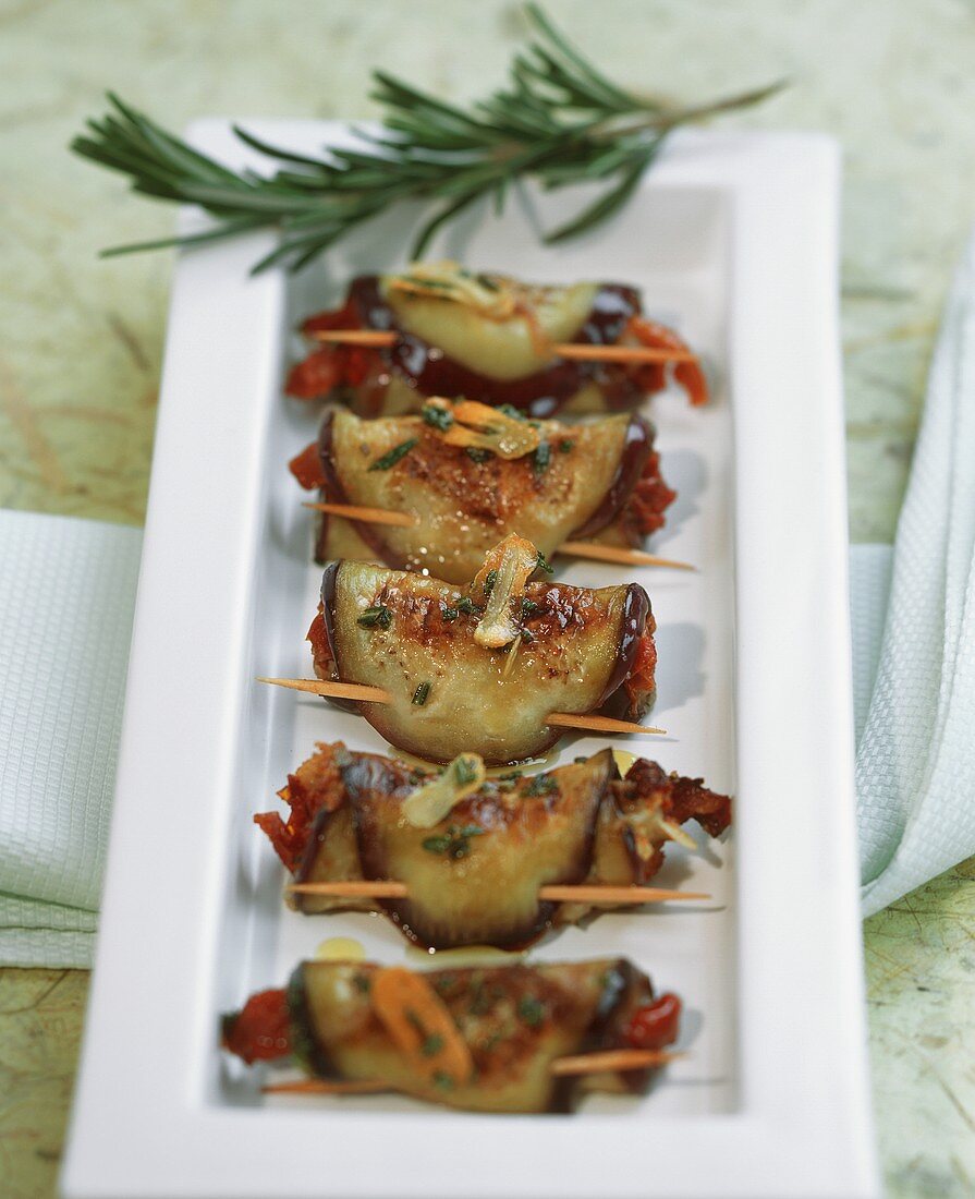 Aubergine rolls with dried tomatoes and pecorino