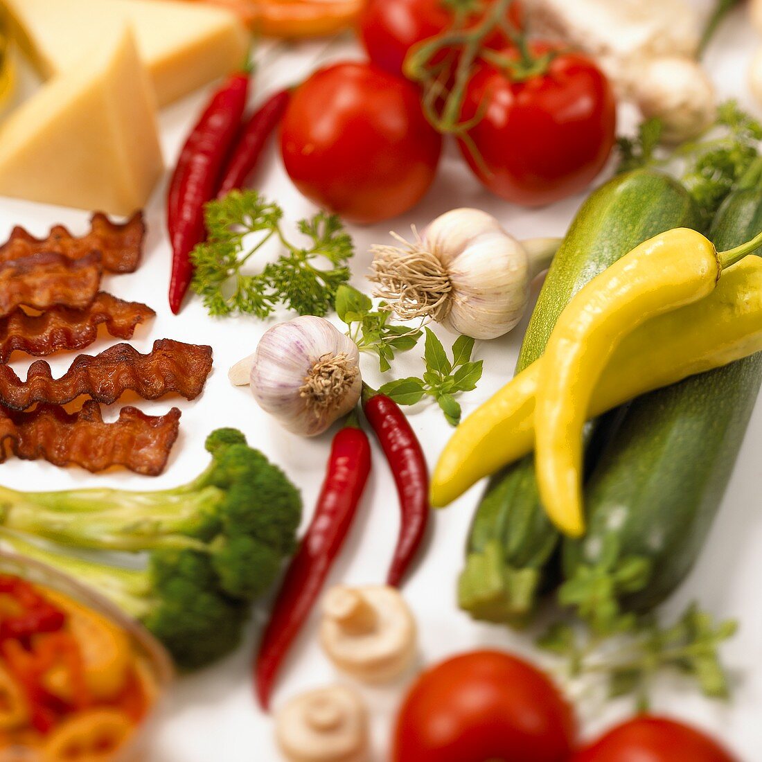 Vegetable still life with bacon and cheese