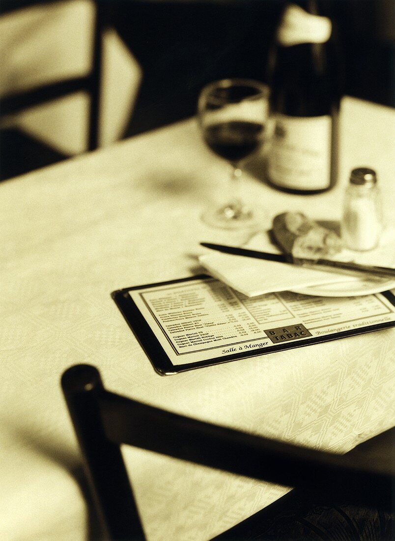 Menu with side plate, baguette and red wine