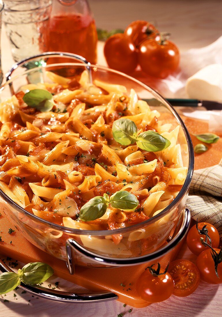 Penne and tomato bake in glass baking dish