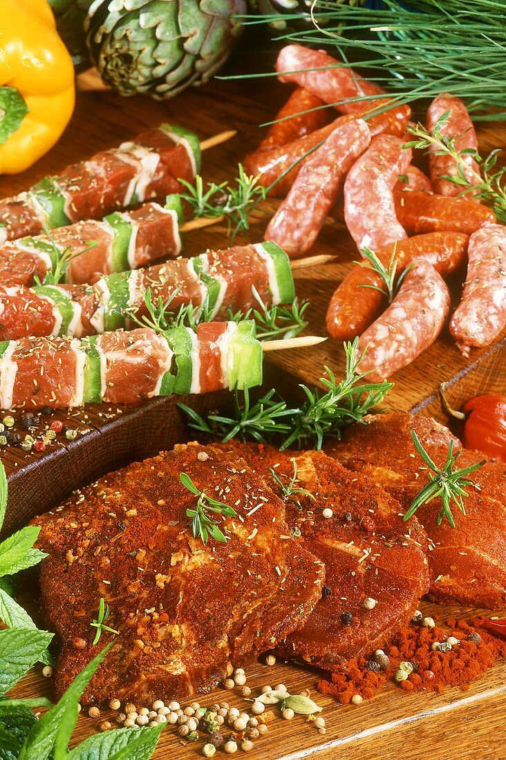 Chipolata sausages, meat kebabs and spiced meat slices