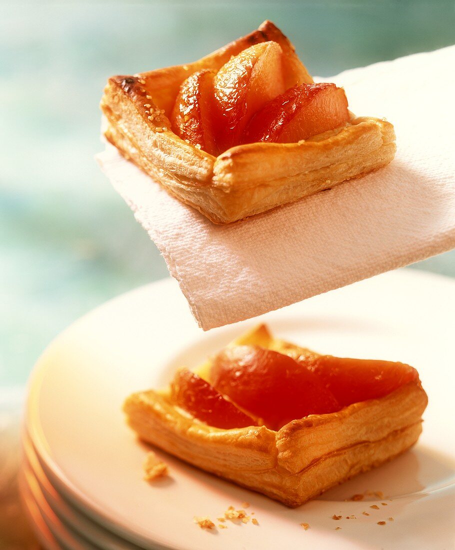 Peach slices in puff pastry squares