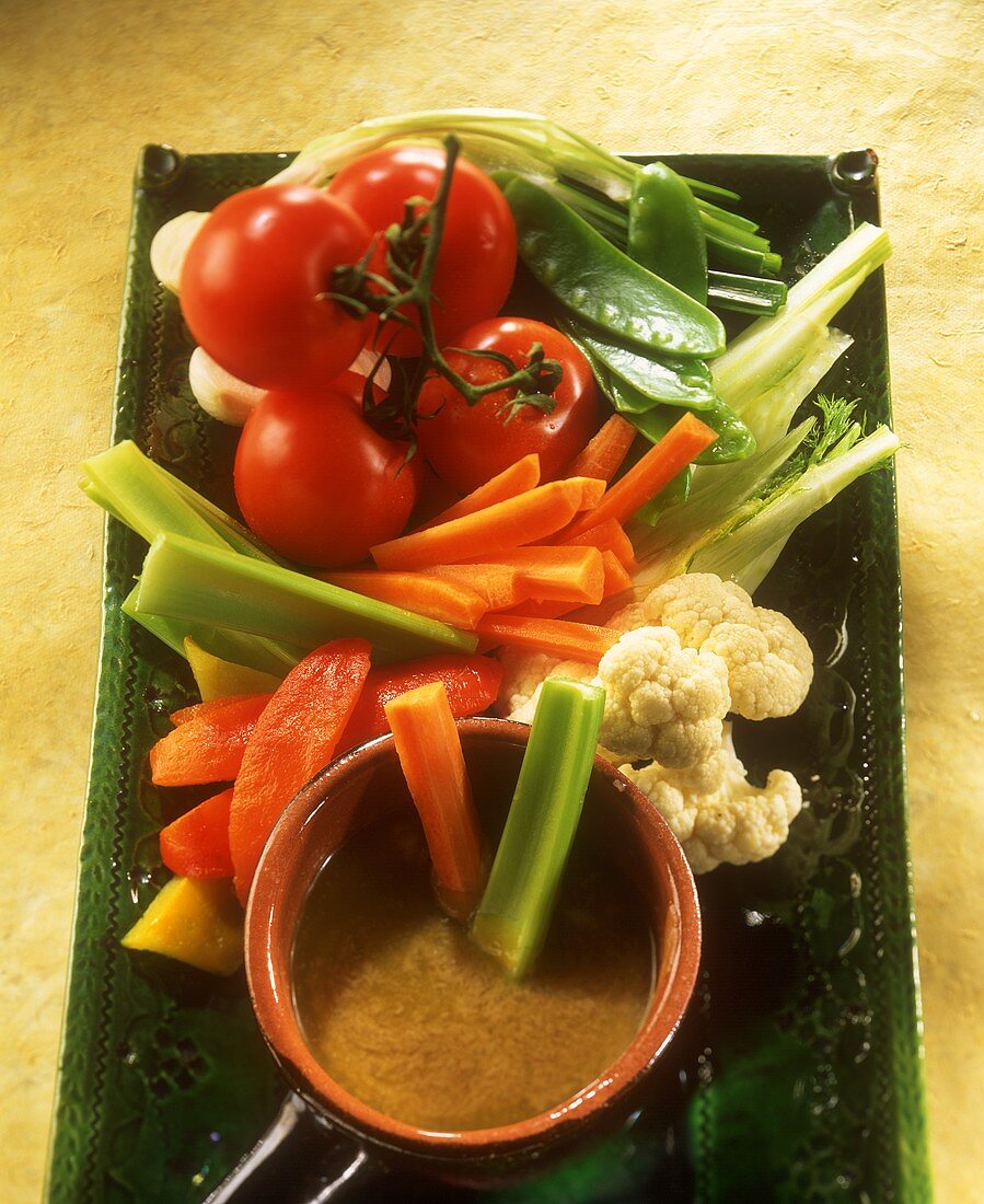 Bagna cauda (hot anchovy sauce with vegetable sticks, Italy)