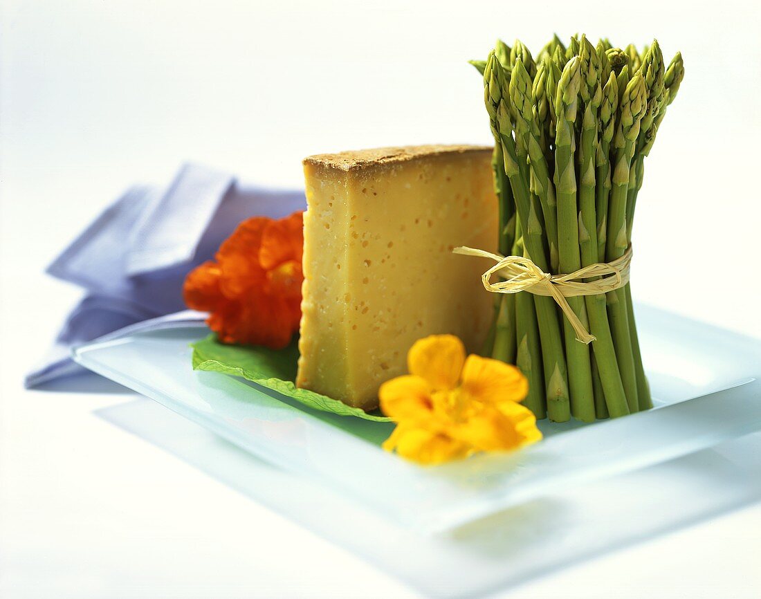 Still life with asparagus, cheese and nasturtium flowers