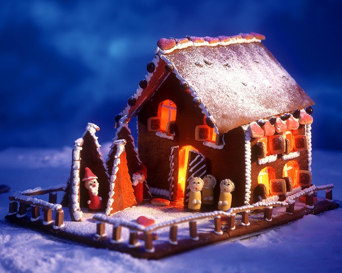 Gingerbread house with small marzipan figures