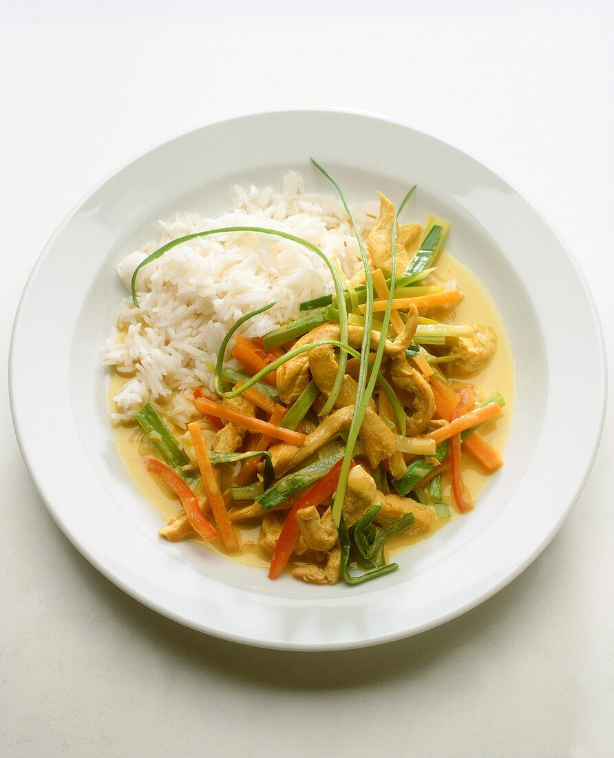 Chicken & vegetables cooked in wok with coconut sauce & rice