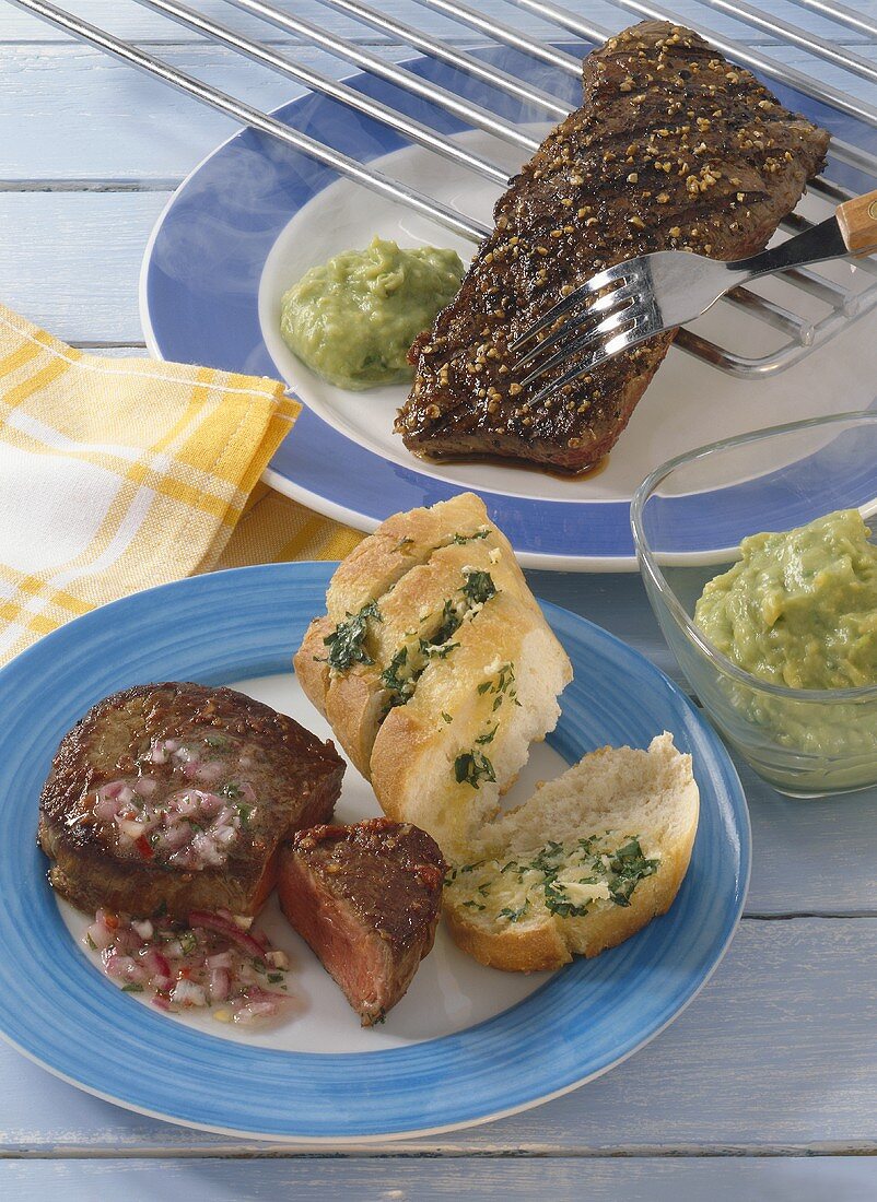 Peppered steak with avocado dip, beef fillet with baguette