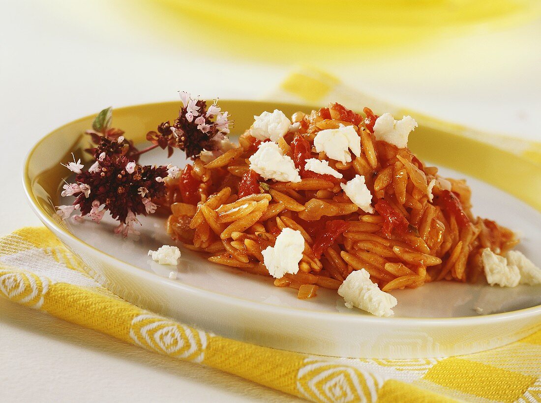 Greek rice noodles with tomatoes and feta