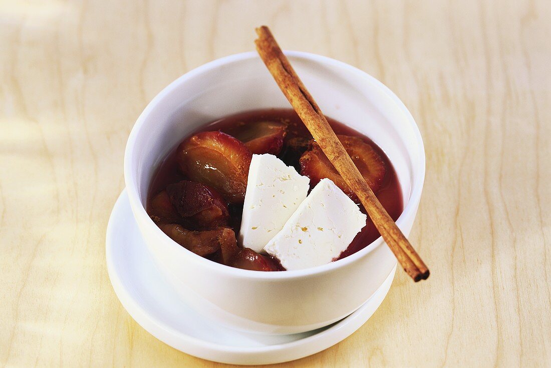 Plum compote with cinnamon and sheep's cheese