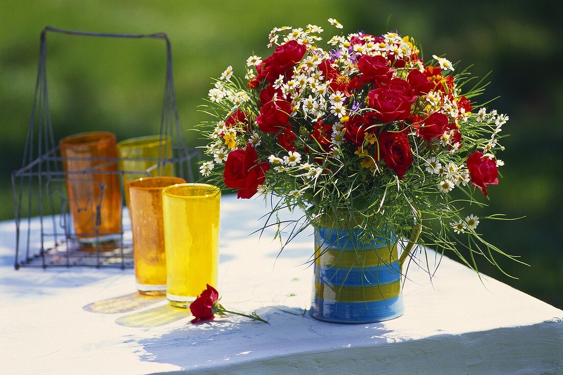 Bouquet of red roses in jug