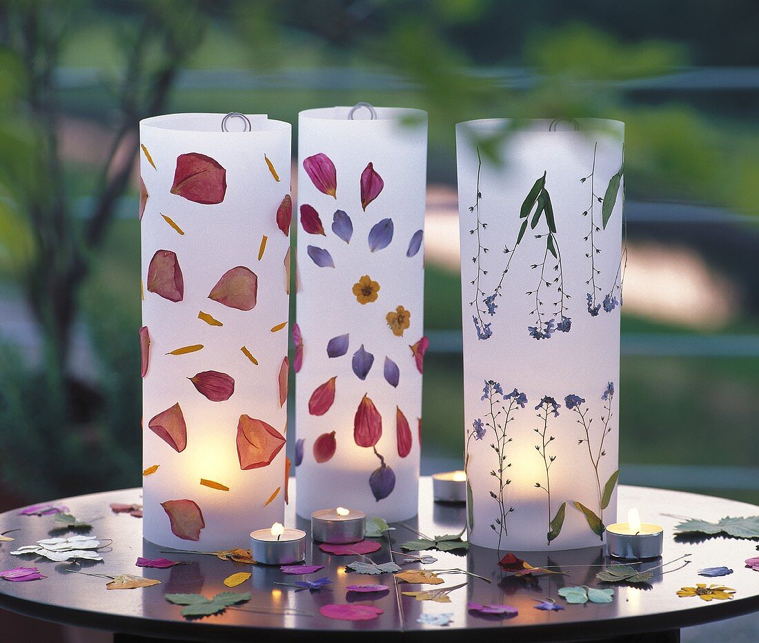 Paper cases stuck with flower petals as garden lights