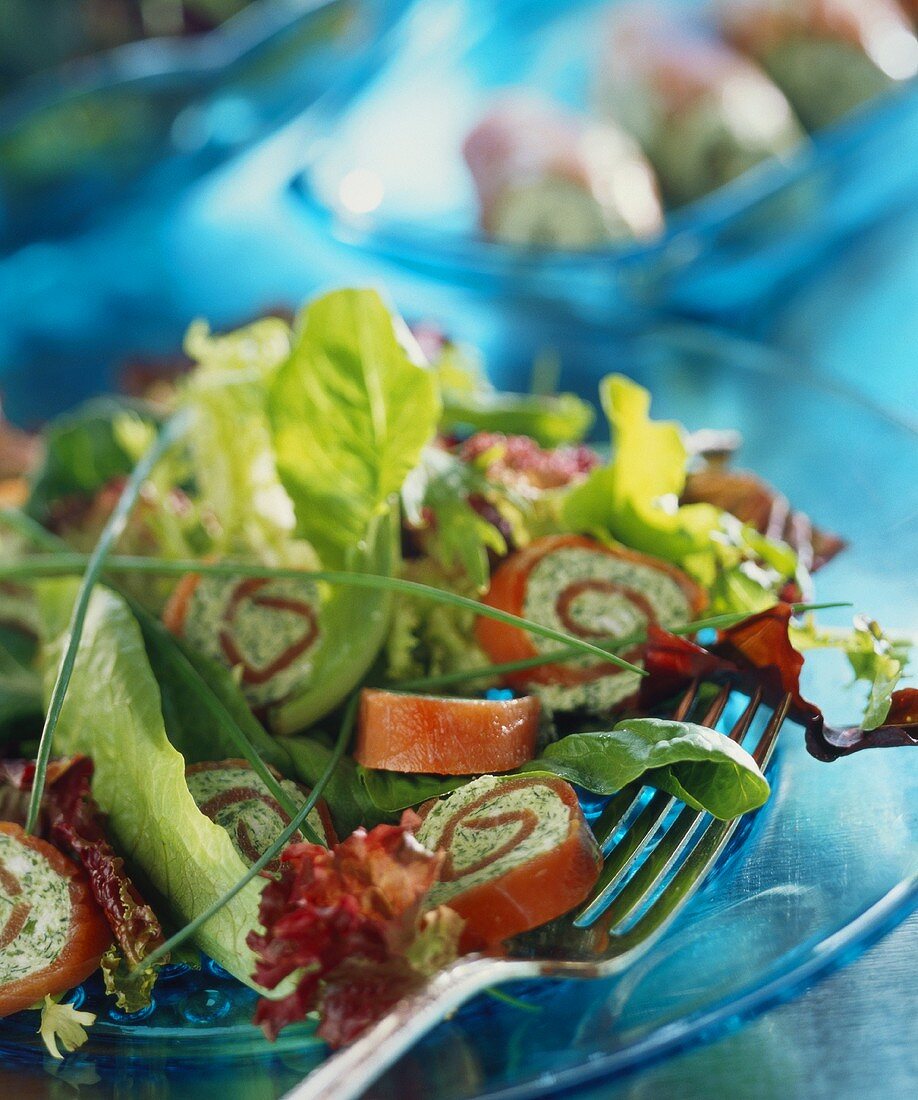 Salmon rolls with mixed salad leaves