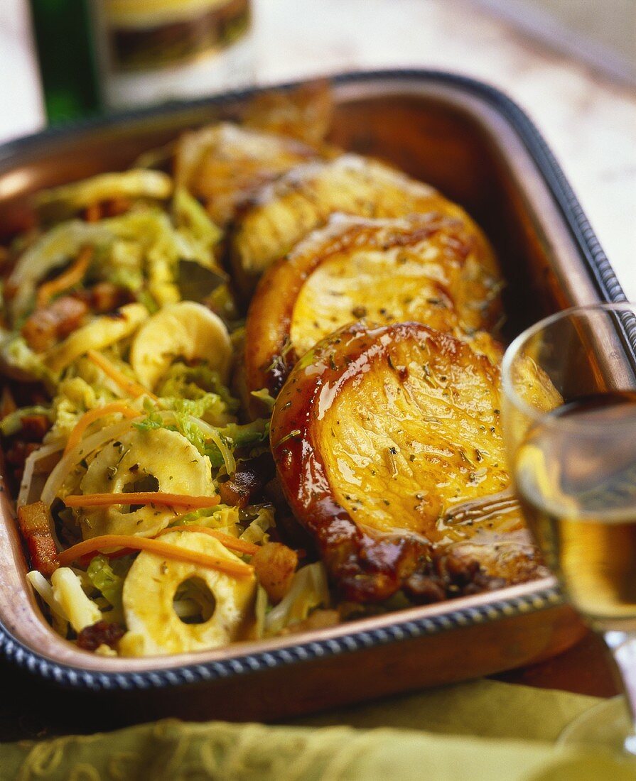 Glazed pork chops with apples and cabbage