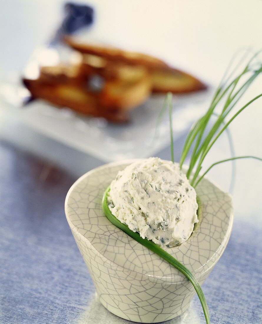 Portion of soft cheese with chives