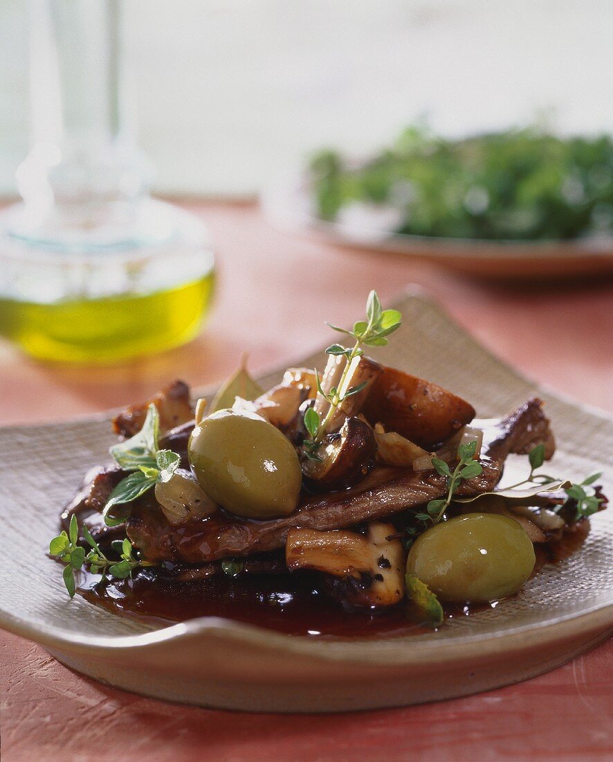 Beef with mushrooms and green olives