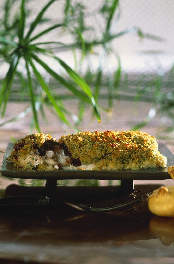 Cod fillet with black olives and herb crust