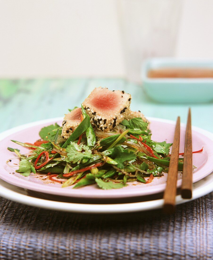 Tuna with sesame crust on glass noodle and mangetout salad