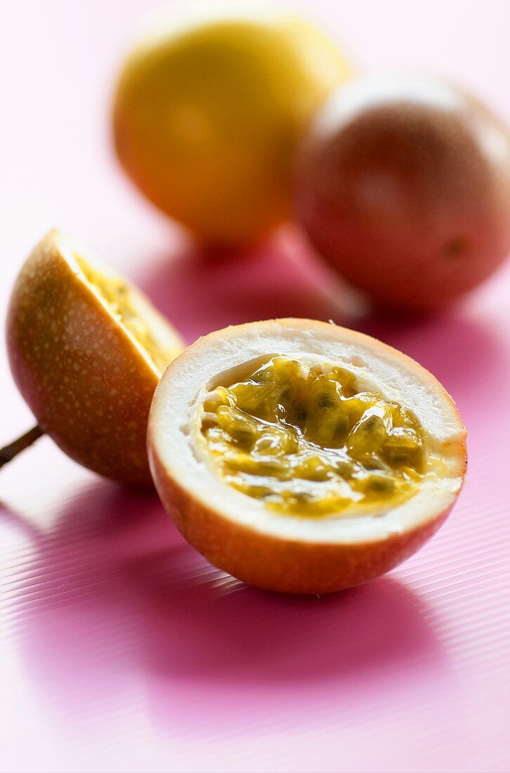 Passion fruits (from Thailand) one cut open