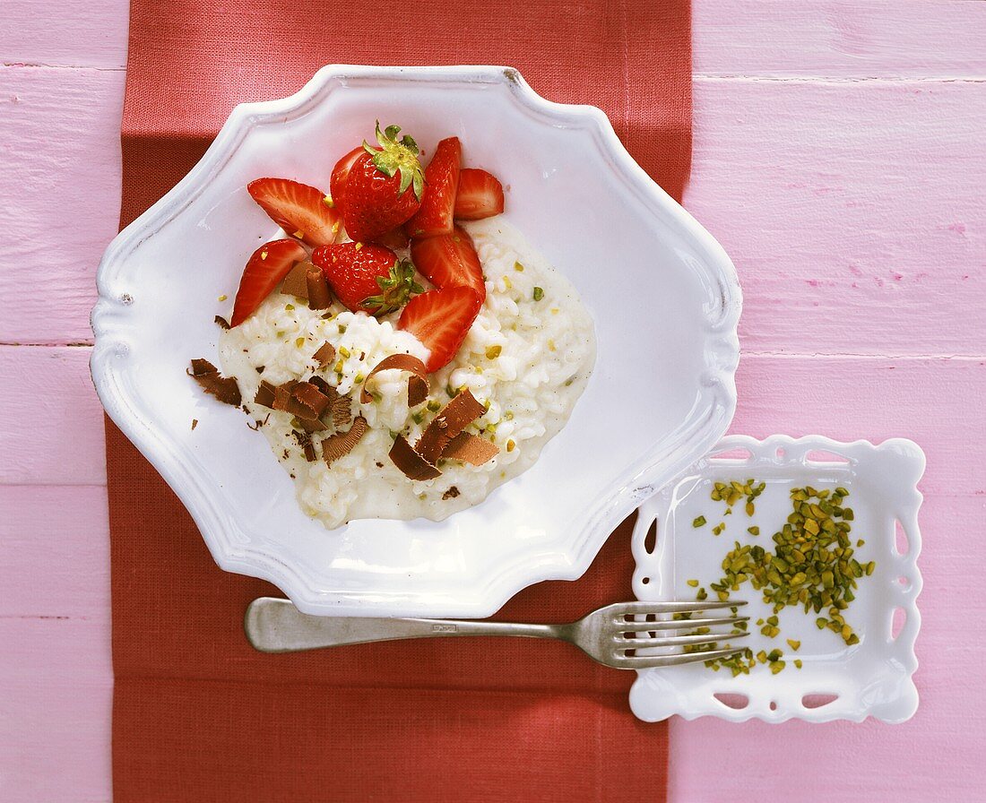 Sweet risotto with strawberries, pistachios & chocolate curls
