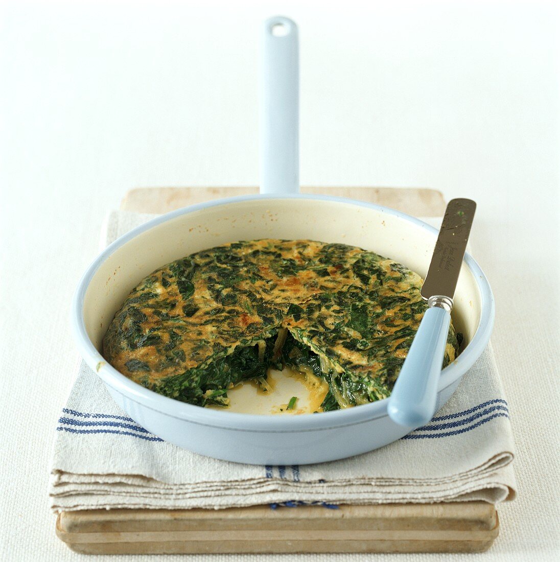 Spinach frittata in round baking dish