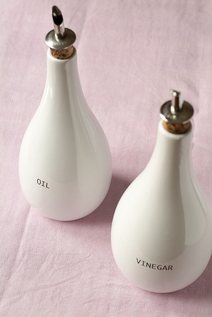 Oil and vinegar bottles with the words 'Oil' and 'Vinegar'