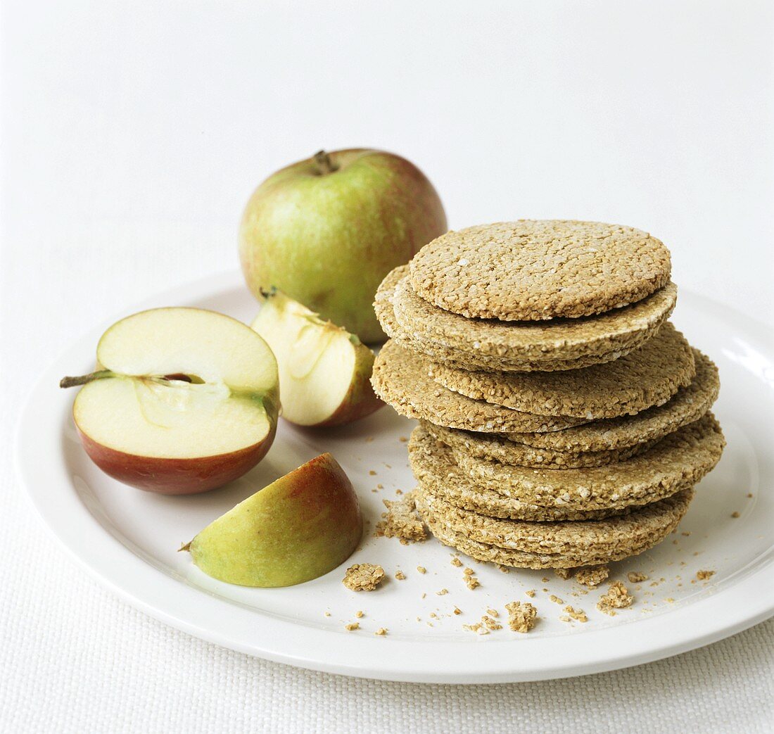 Oatmeal biscuits (low-fat) and apples on a plate