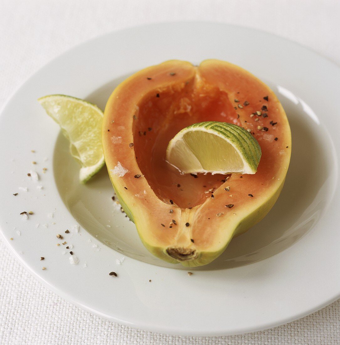 Papaya with lime, salt and pepper