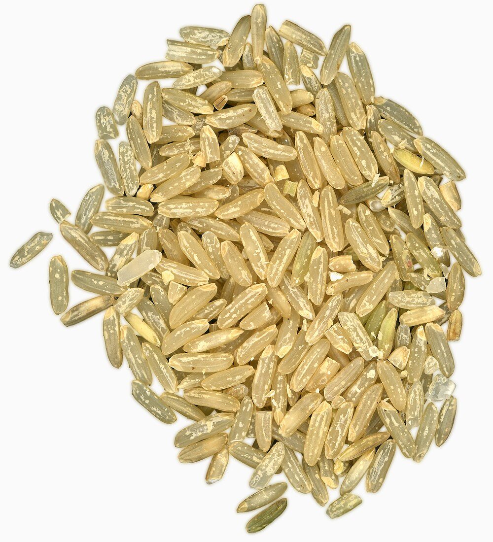 A heap of brown long-grain rice