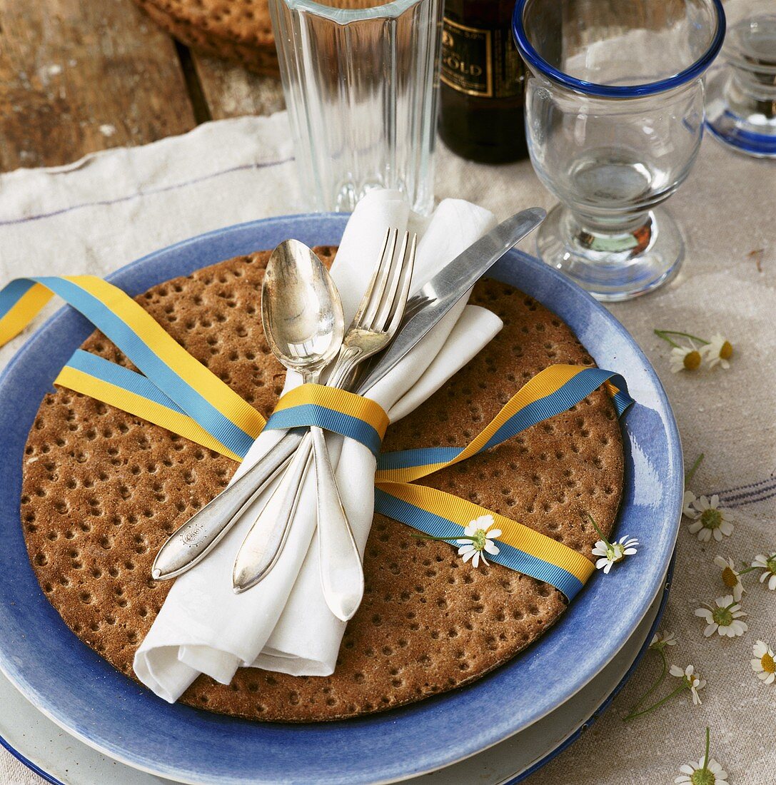 A Swedish place setting with round crispbread